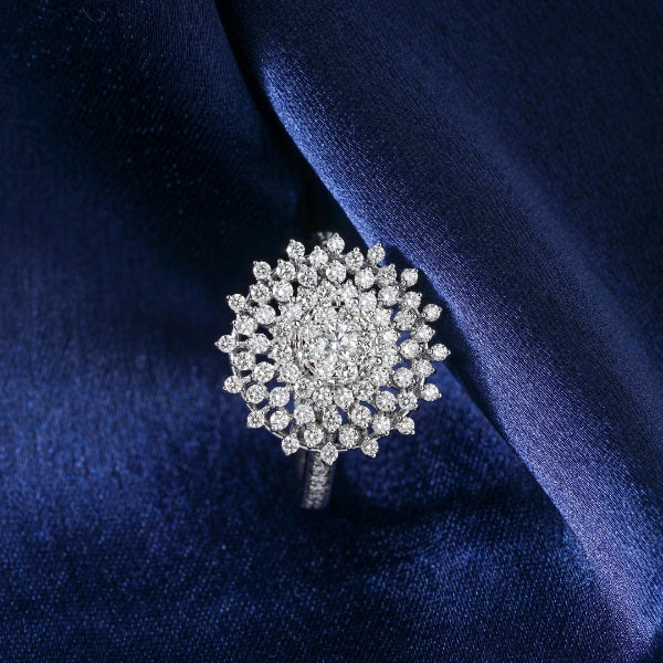Custom diamond ring with a variety of diamonds in white gold