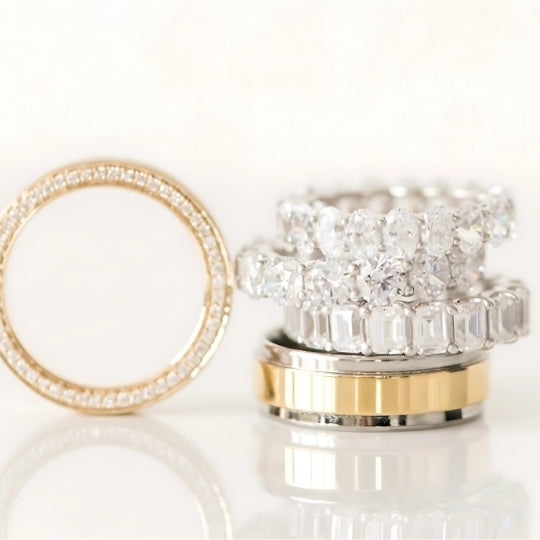 Stack of wedding rings for him and her with diamond in white and yellow gold