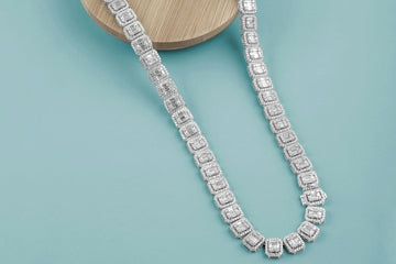 Custom Diamond Encrusted Necklace with Emerald Cut Diamonds nestled in Round Cut Diamond Halo's