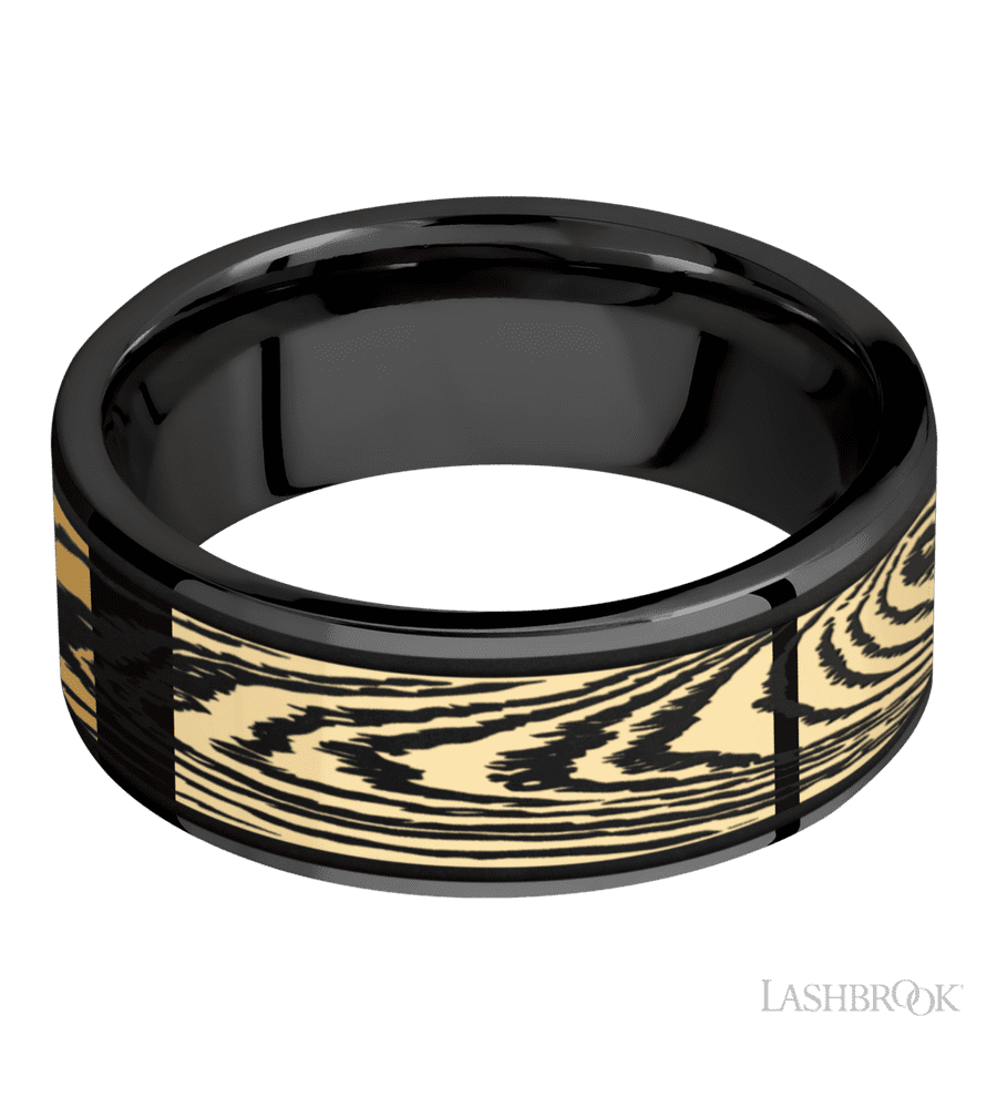 8 mm wide/Flat/Zirconium band with one 6 mm Centered inlay of 14K Yellow Gold with a laser carved Woodgrain pattern.