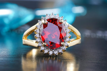 Custom Ruby Ring with Diamond Halo and Split Shank Setting in Yellow Gold