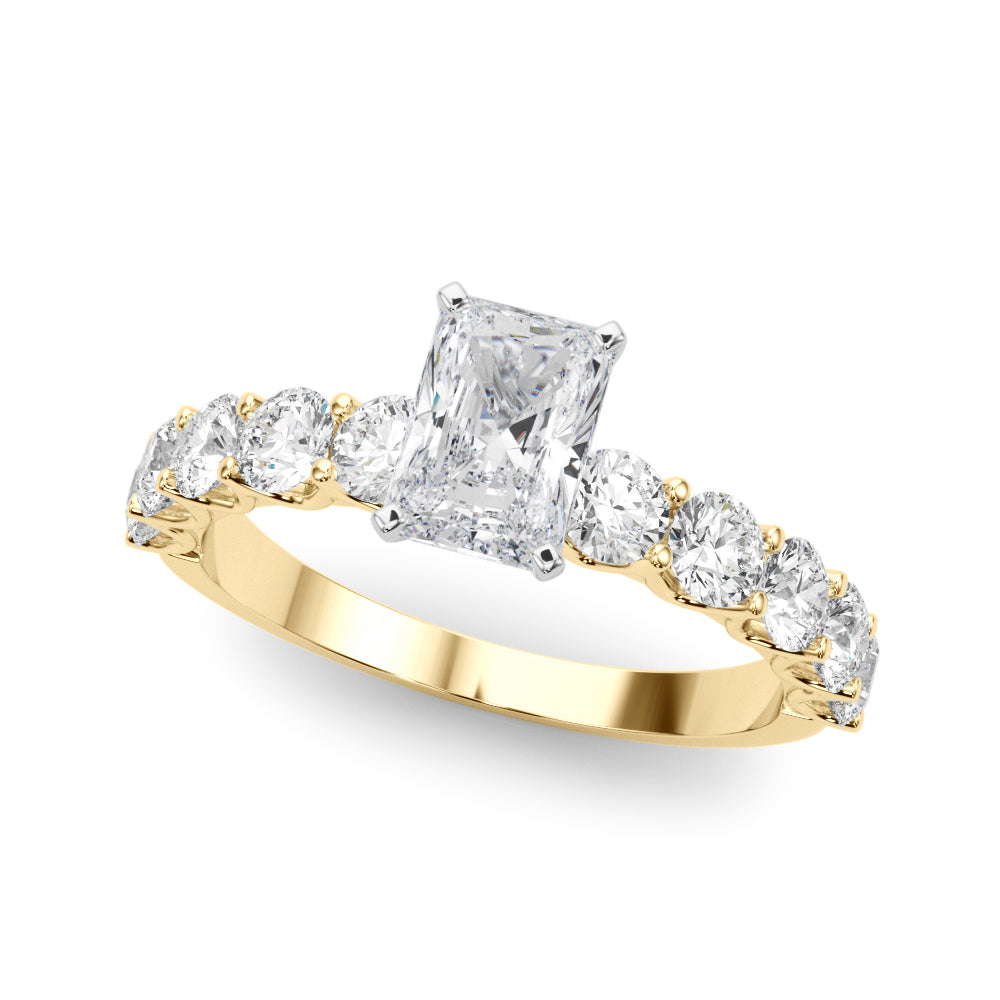 Top view of radiant diamond ring in a prong setting with a large pave shank in yellow gold