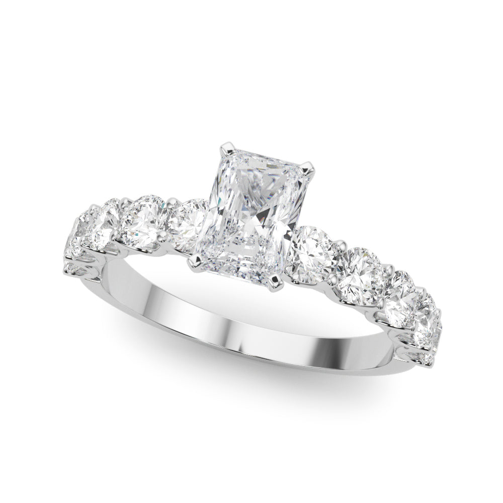 Top view of radiant diamond ring in a prong setting with a large pave shank in white gold
