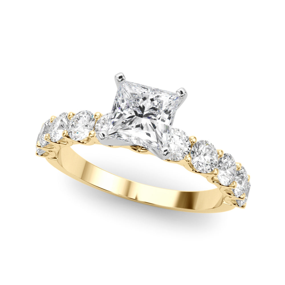 Top view of princess cut diamond ring in a prong setting with a large pave shank in yellow gold