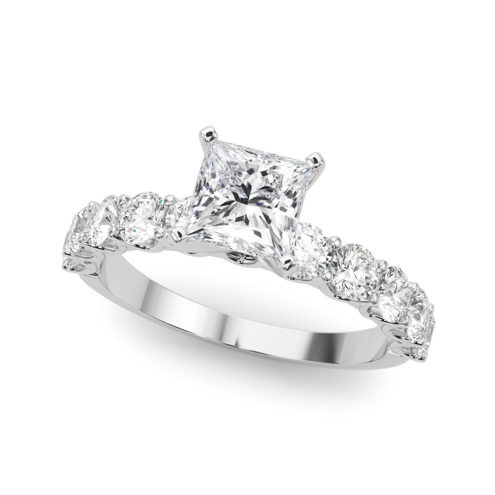 Top view of princess cut diamond ring in a prong setting with a large pave shank in white gold