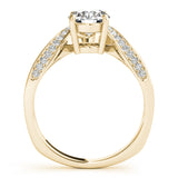 Side view of a round diamond ring in a cathedral prong setting with a euro pave shank in yellow gold