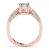 Side view of a round diamond ring in a cathedral prong setting with a euro pave shank in rose gold
