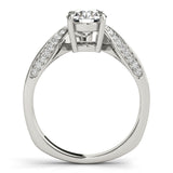 Side view of a round diamond ring in a cathedral prong setting with a euro pave shank in white gold