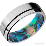 7 mm wide/Flat/14K White Gold band with one 0.5 mm Off Center inlay of Black also featuring a Abalone sleeve.