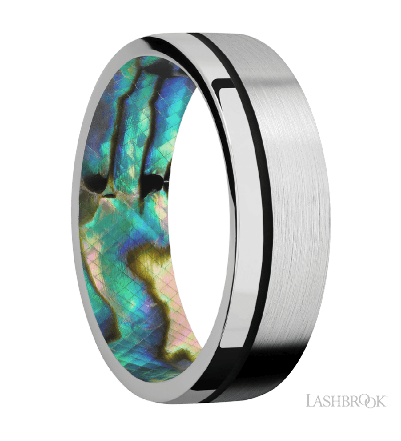 7 mm wide/Flat/14K White Gold band with one 0.5 mm Off Center inlay of Black also featuring a Abalone sleeve.