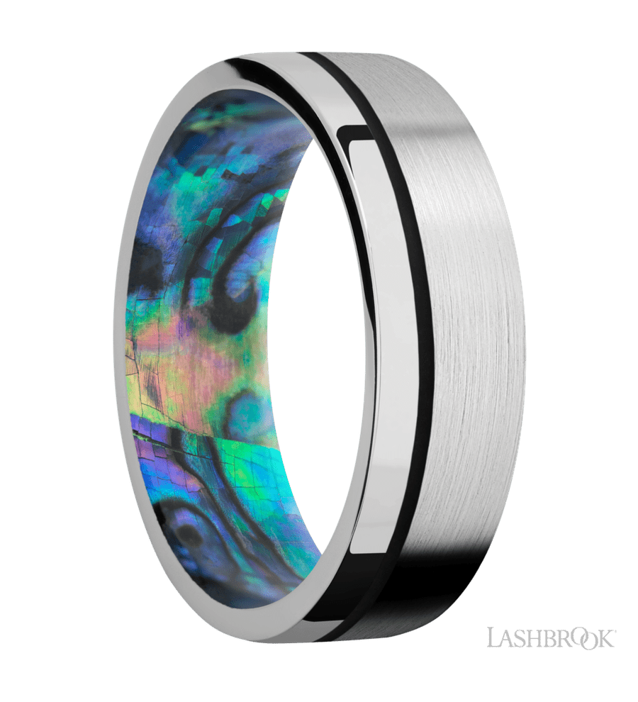7 mm wide/Flat/14K White Gold band with one 0.5 mm Off Center inlay of Black also featuring a Abalone sleeve.