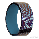 9 mm wide Flat Titanium Damascus band featuring a Royal Blue sleeve.