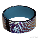 9 mm wide Flat Titanium Damascus band featuring a Royal Blue sleeve.