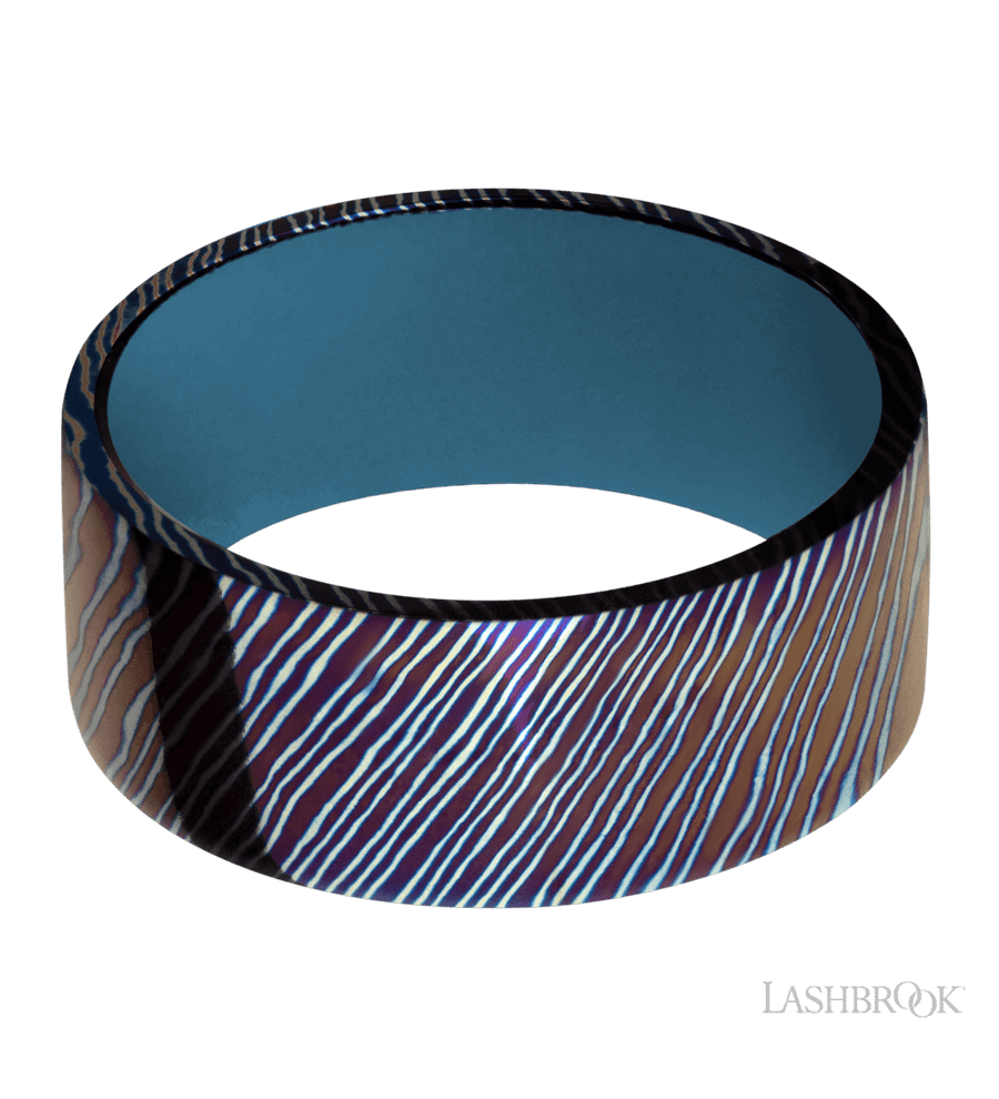9 mm wide Flat Titanium Damascus band featuring a Royal Blue sleeve.