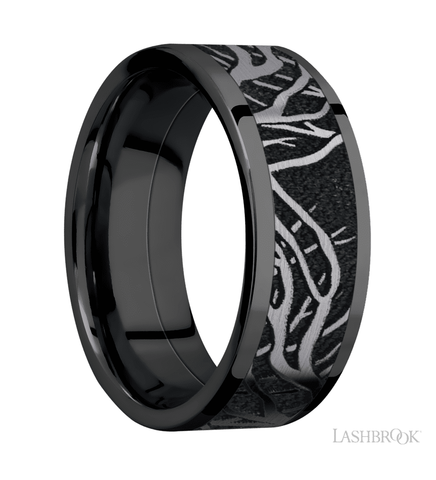 8 mm wide/Flat/Zirconium band with one 6 mm Centered inlay of Tantalum with a laser carved Branches pattern.