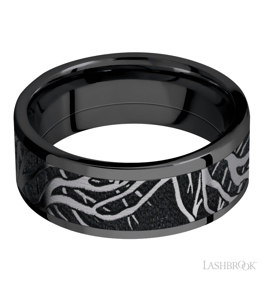 8 mm wide/Flat/Zirconium band with one 6 mm Centered inlay of Tantalum with a laser carved Branches pattern.