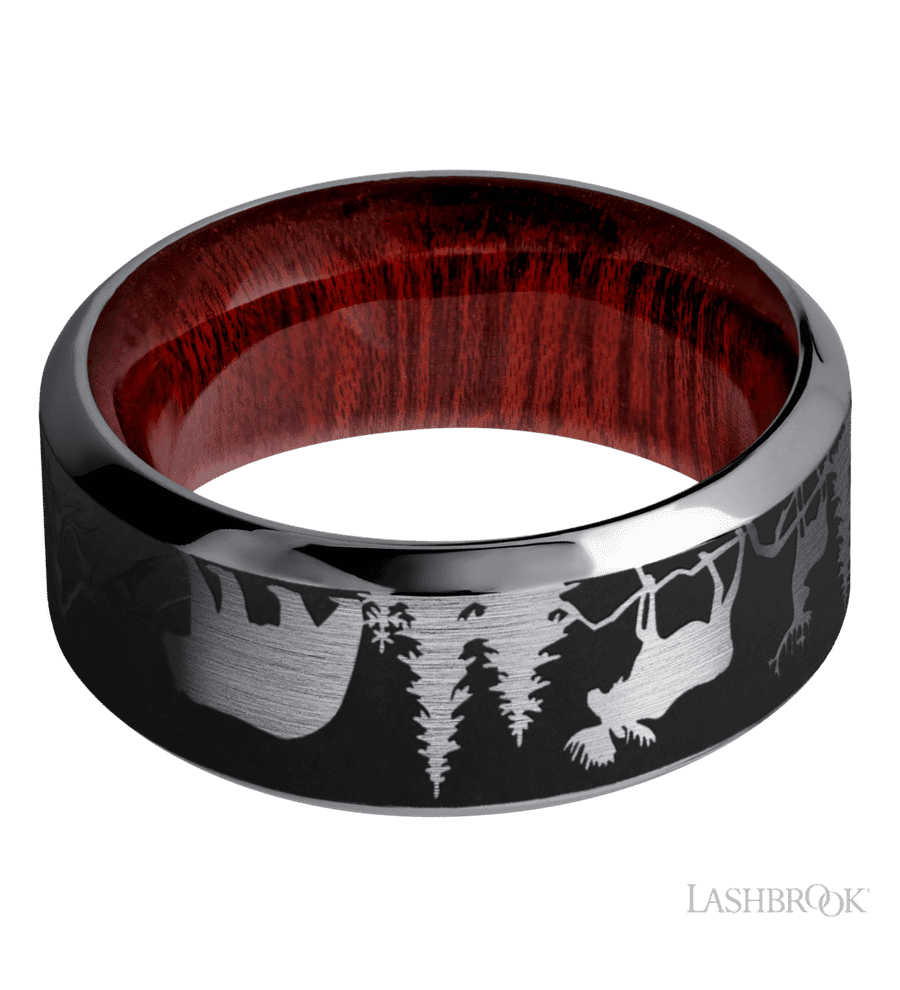 9 mm wide/High Bevel/Tantalum band with a laser carved Bear Moose Deer Mountain pattern also featuring a Blood Wood sleeve.