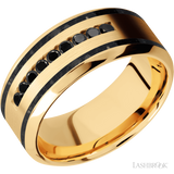 9 mm wide/High Bevel/14K Yellow Gold band with  two 1 mm Wide inlays of Black Onyx and featuring an  arrangement of 9, .03 carat Round Black Diamond stones in a Channel setting