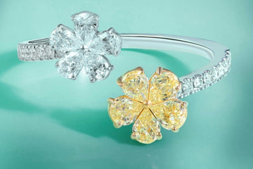 White gold custom ring with pave setting ending in white and yellow diamonds in two flower motives