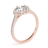 Angle view of round center cushion halo ring in a cathedral prong setting with a single row pave shank in rose gold