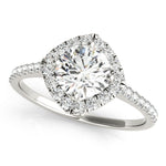 Top view of round center cushion halo ring in a cathedral prong setting with a single row pave shank in white gold