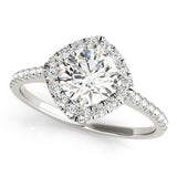 Top view of round center cushion halo ring in a cathedral prong setting with a single row pave shank in white gold