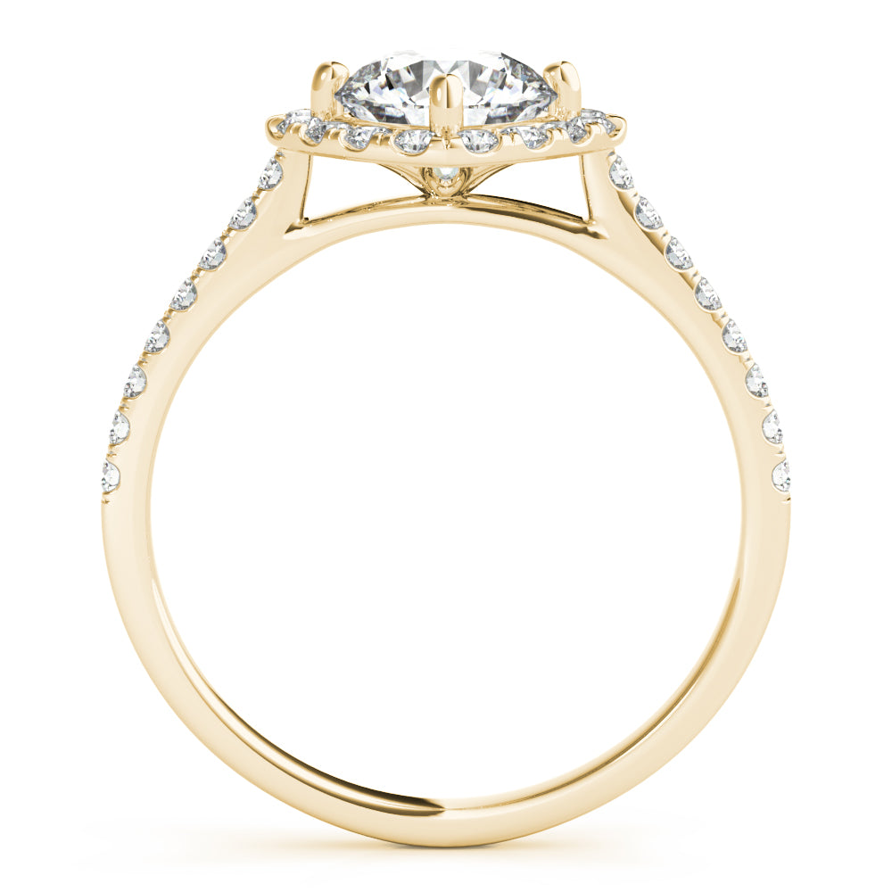 Side view of round center cushion halo ring in a cathedral prong setting with a single row pave shank in yellow gold