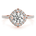Front view of round center cushion halo ring in a cathedral prong setting with a single row pave shank in rose gold