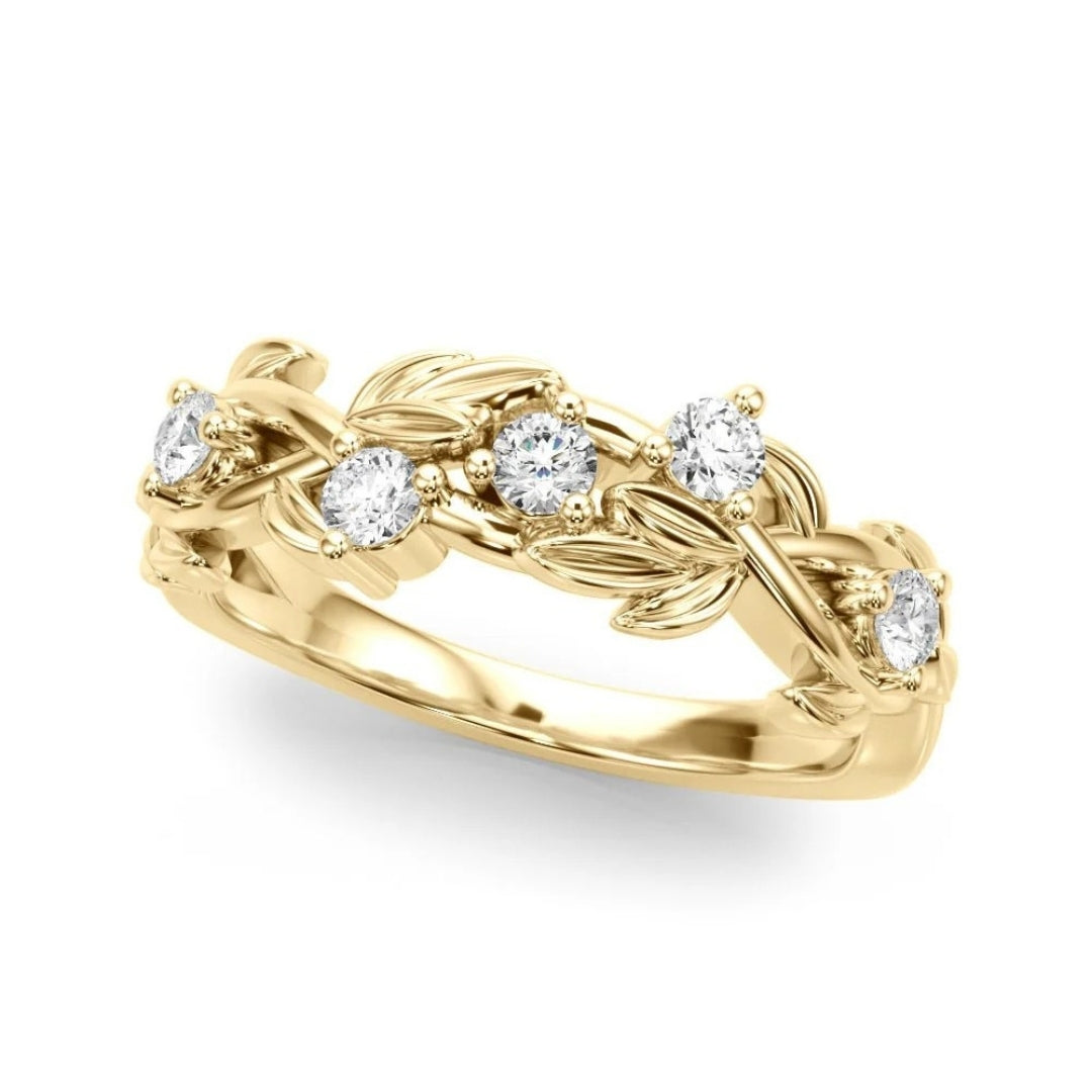 Gold ring with diamond accents on a white background