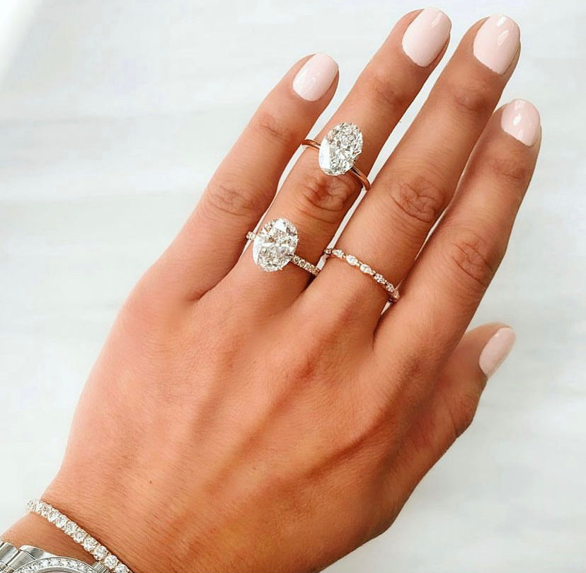 Hand with solitaire diamond rings
