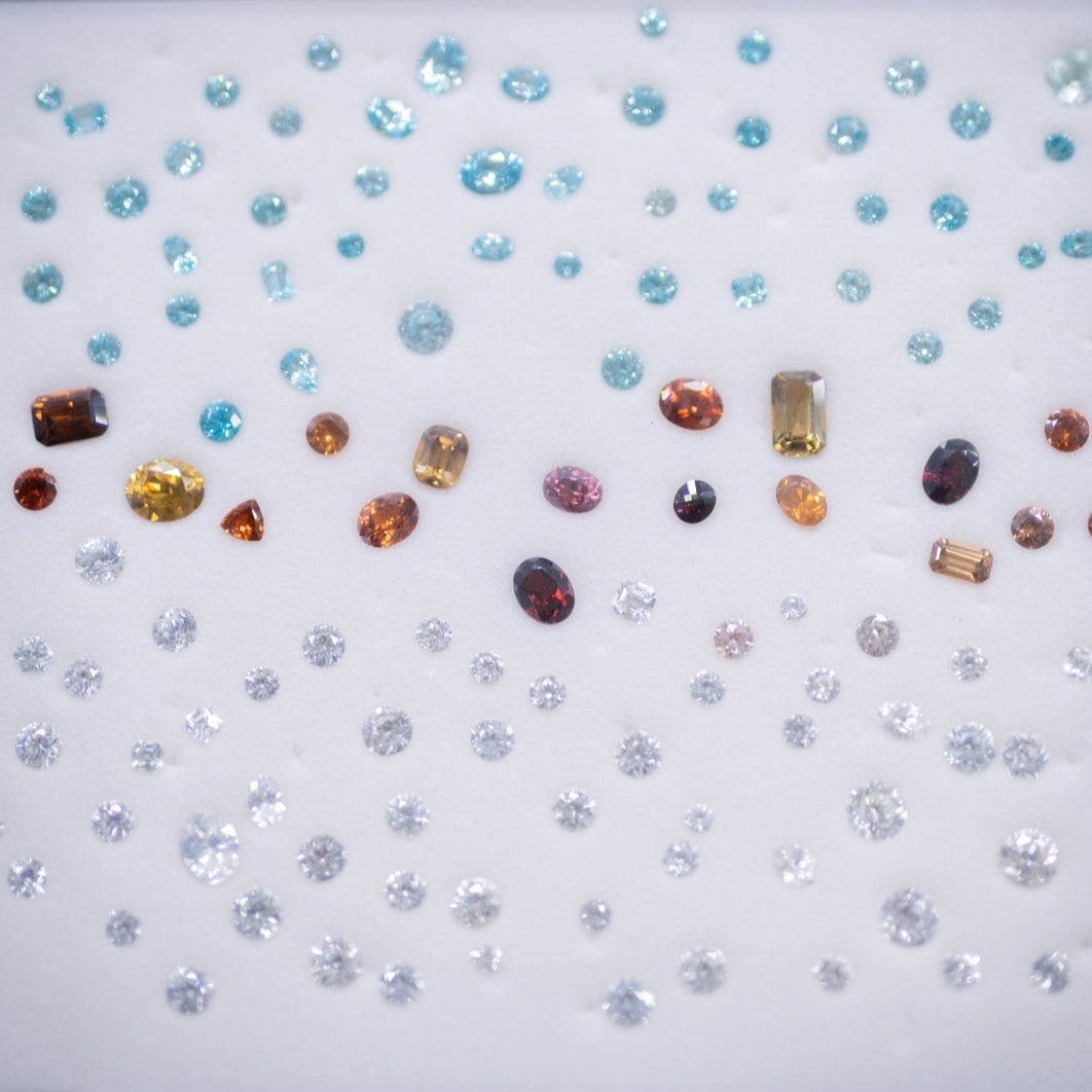 Assorted gemstones on a white background