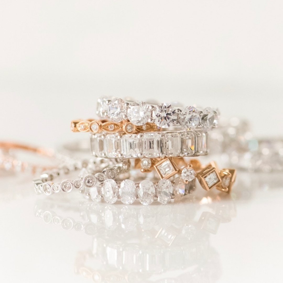 Stack of diamond wedding bands in white and yellow gold