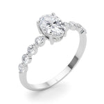 Oval Center Ring with Smaller Round Stones Along the Shank - Diamonds By Rothschild