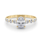 Oval Center Ring with Smaller Round Stones Along the Shank - Diamonds By Rothschild